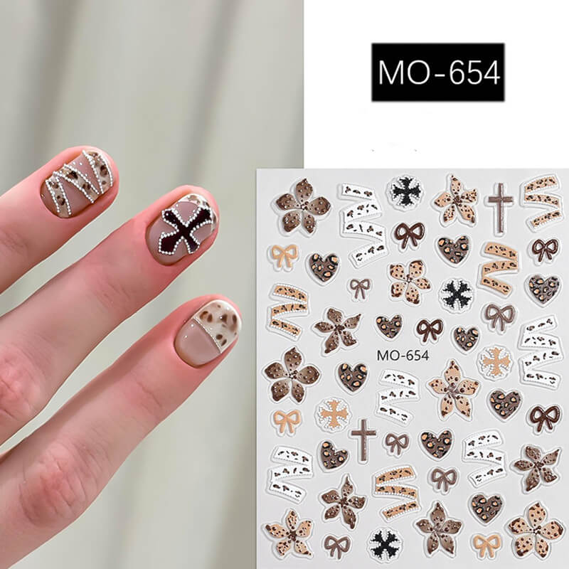 Maillard style nail sticker sheet featuring star, cross, and leopard print designs in warm caramel and brown tones.