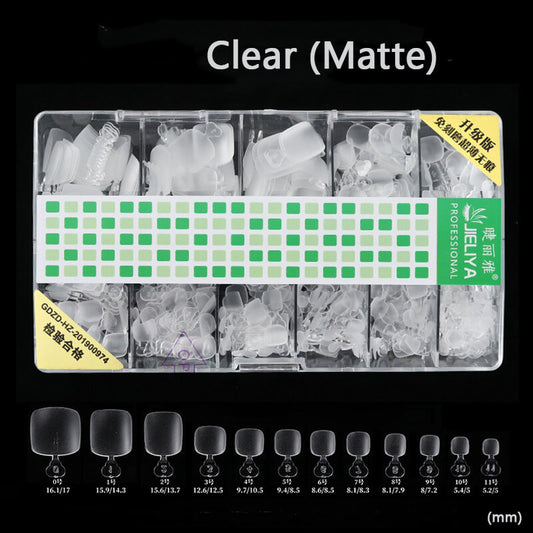No buffing toenail tips set with assorted sizes arranged on display stand