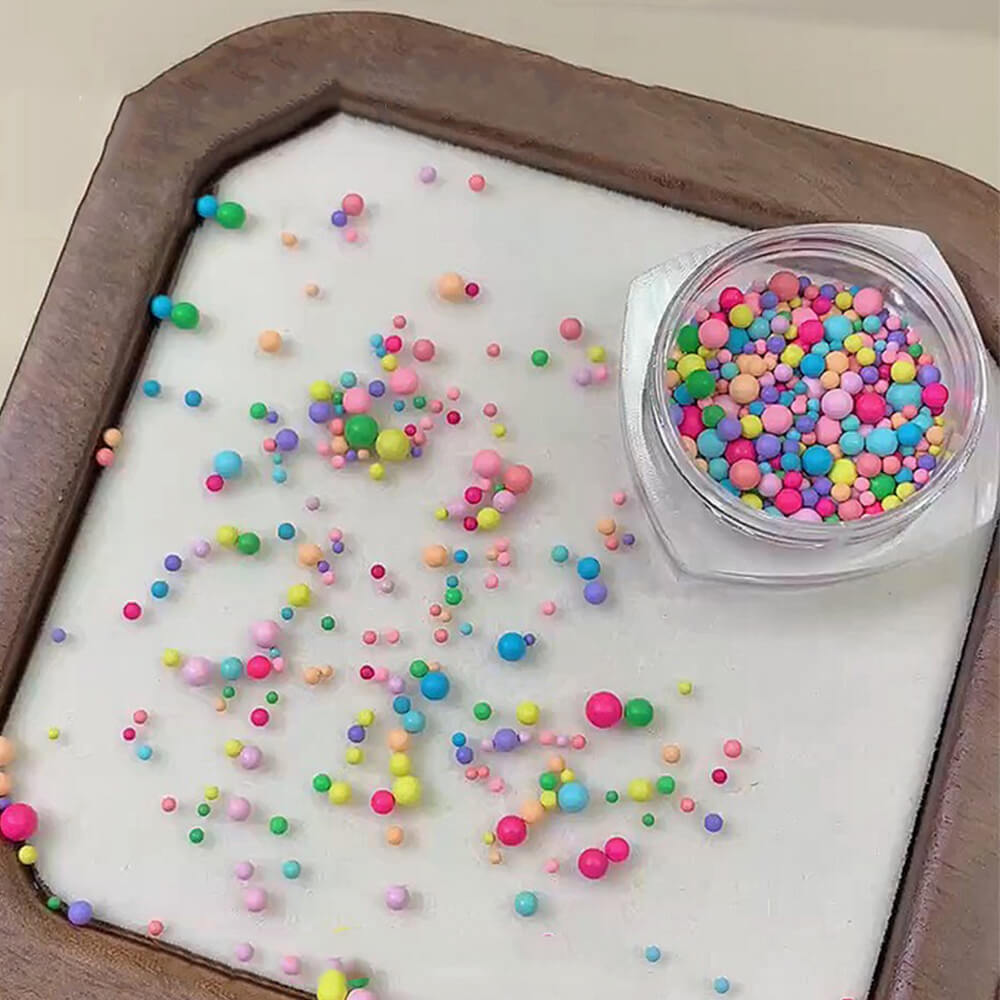 Colorful nail beads and metal charms set with rainbow micro beads and assorted metal shapes