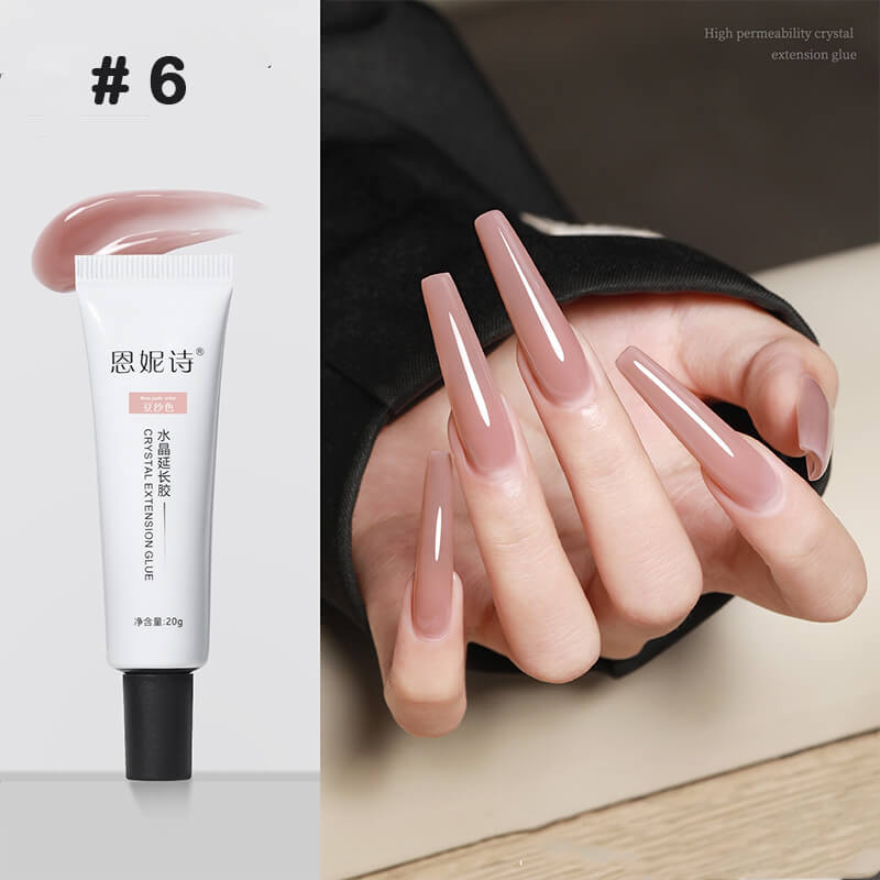 Nail extension gel tube with a hand displaying long, painted nails.