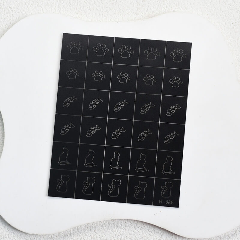 Nail art sticker sheet featuring cat and fish