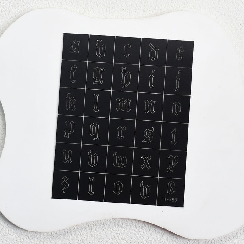 Nail art sticker sheet featuring letters