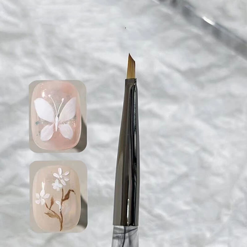 Fine line work creating butterfly wing patterns with precision nail art pen
