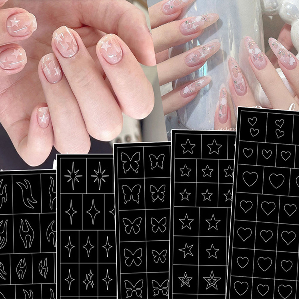 A set of nail art stickers with various designs such as hearts, stars, and butterflies applied on fingernails, alongside a sheet of the same stickers.