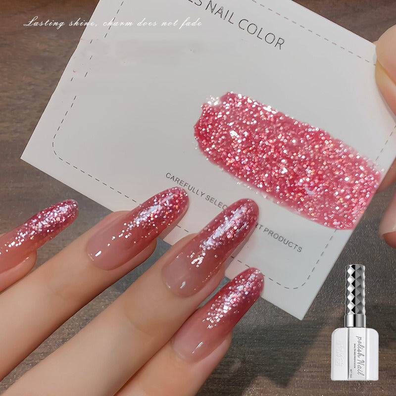 Fine sparkle nail art gel creating delicate shimmer effect like fresh snow catching light-red