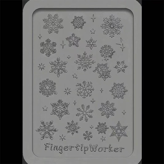 Flexible silicone nail art mold featuring multiple 3D snowflake designs in various sizes.