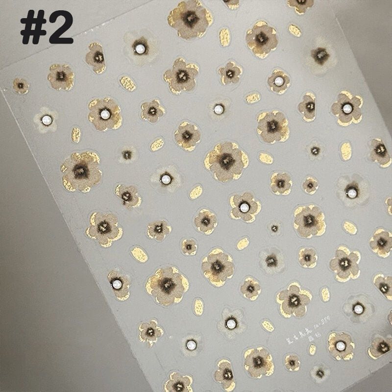 Vintage black and gold 3D floral nail sticker sheet with embossed petals and blooming designs.