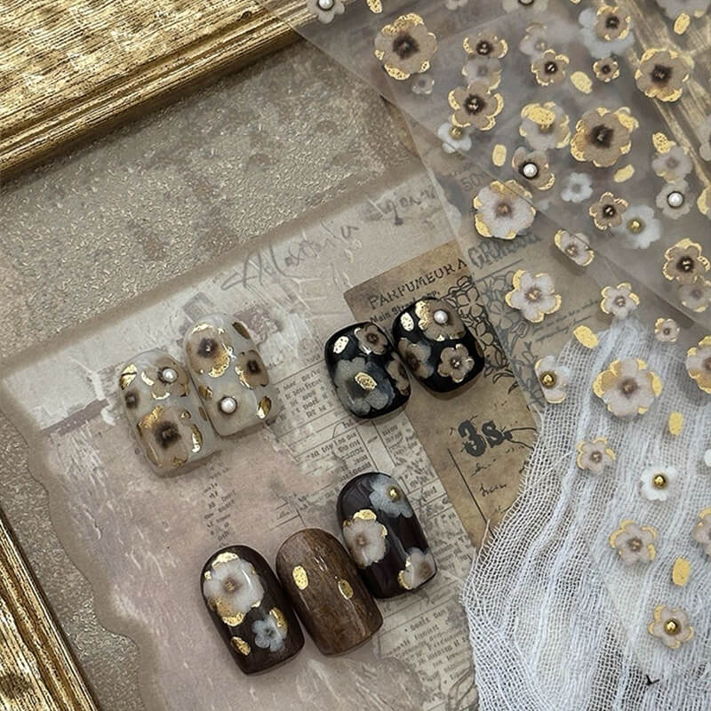 Side view of vintage floral nail sticker demonstrating raised 3D dimension.