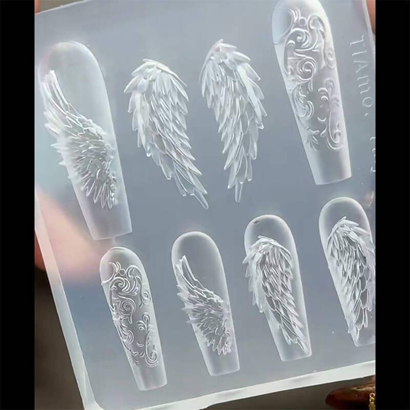 Wings nail silicone mold featuring multiple wing-shaped cavities in various sizes and styles