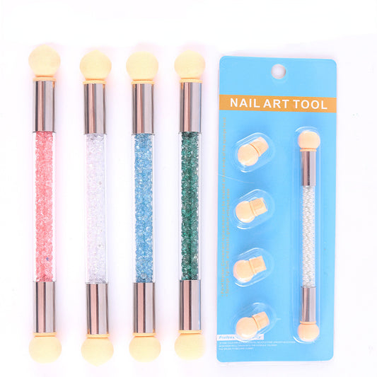 A set of nail art tools with four sponge heads and two-way speakers, packaged on a blue blister pack with a nail art dotting pen and additional sponge heads displayed in the background.