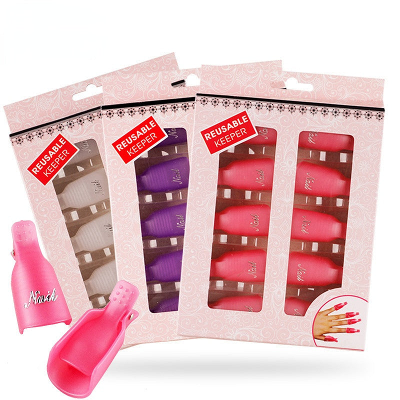 A set of nail polish remover clips in four colors packaged in pink and purple boxes with 'Reusable Keeper' text and a demonstration image of a nail showing the before and after effect of using the clip.