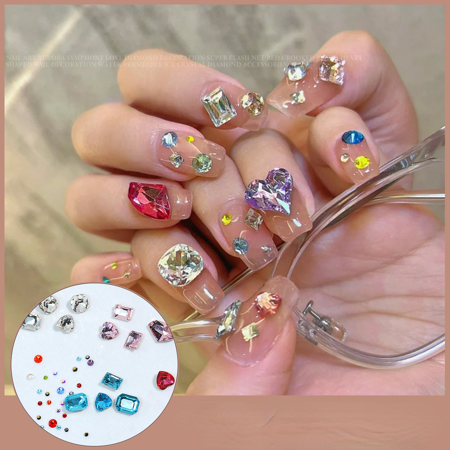 A collection of rhinestone and gemstone decorations for nails, held by a hand, with a variety of colors and shapes displayed, including a heart-shaped rhinestone and a cluster of square rhinestones.