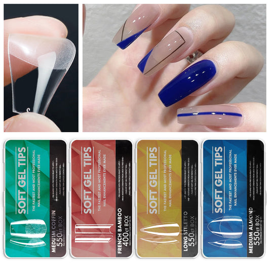 A collection of fake nail tips in various colors displayed on a person's nails, with the tips having a clear or transparent appearance.