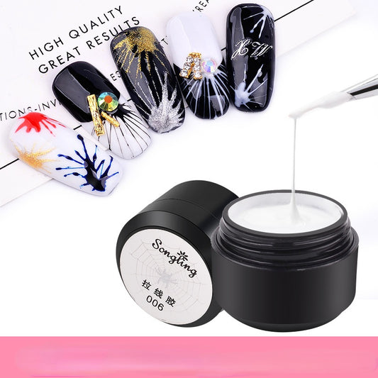 A bottle of Spider Gel for nail art with several examples of nail polish designs showcasing the product's capability. The main color of the gel appears to be clear or close to clear, and the bottle has a black cap with white and gold text.