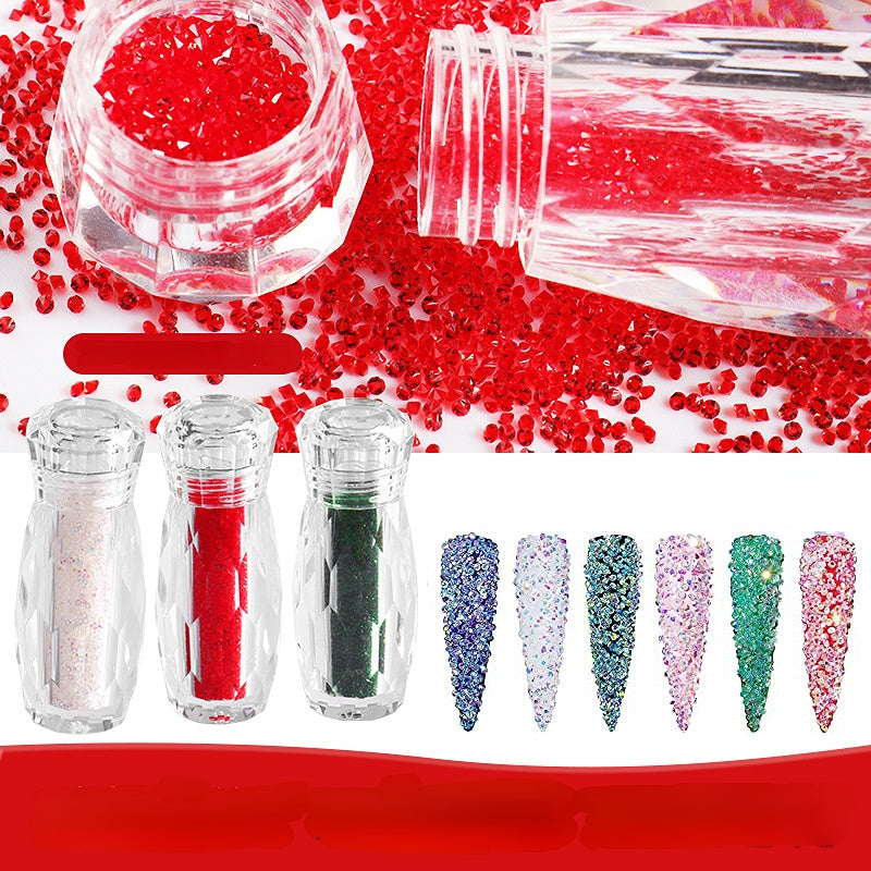 A collection of ultra mini rhinestone nail art, with beads in various colors and a set of clear nail decals with a brush.