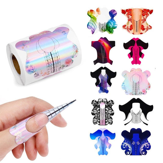 A collection of colorful nail extension form stickers in various designs, with a roll of stickers shown alongside a nail art tool for application.